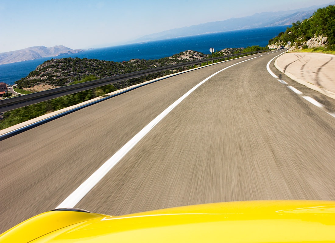 Supercar driving the Dalmatian coast road